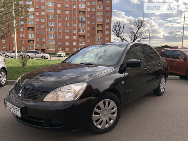 Чорний Міцубісі Lancer, об'ємом двигуна 1.58 л та пробігом 246 тис. км за 4900 $, фото 7 на Automoto.ua