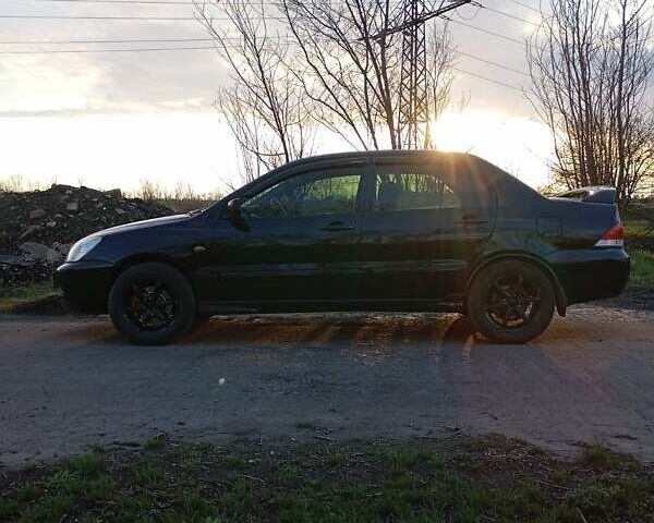 Чорний Міцубісі Lancer, об'ємом двигуна 1.6 л та пробігом 325 тис. км за 4750 $, фото 17 на Automoto.ua