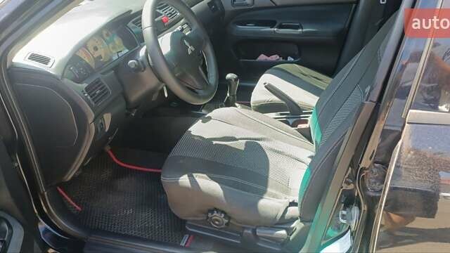 Чорний Міцубісі Lancer, об'ємом двигуна 1.6 л та пробігом 240 тис. км за 3900 $, фото 4 на Automoto.ua