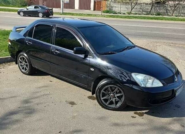 Чорний Міцубісі Lancer, об'ємом двигуна 0.16 л та пробігом 240 тис. км за 4900 $, фото 13 на Automoto.ua