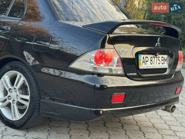 Міцубісі Lancer 2006 у Дніпро (Дніпропетровську) на Automoto.ua Чорний Міцубісі Lancer, об'ємом двигуна 2 л та пробігом 230 тис. км за 4900 $, фото 13 на Automoto.ua
