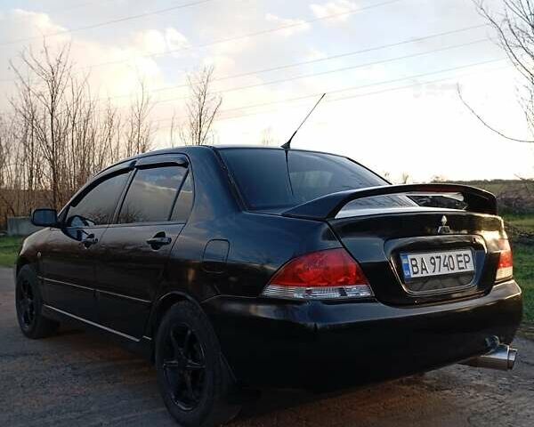 Чорний Міцубісі Lancer, об'ємом двигуна 1.6 л та пробігом 325 тис. км за 4750 $, фото 18 на Automoto.ua