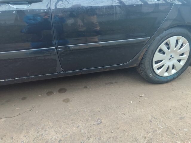 Черный Мицубиси Лансер, объемом двигателя 1.6 л и пробегом 313 тыс. км за 2450 $, фото 11 на Automoto.ua