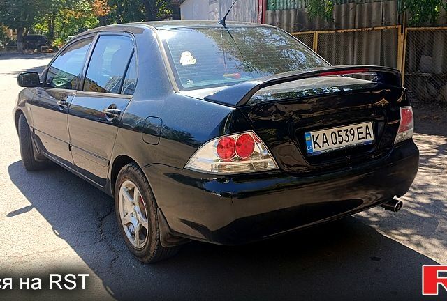 Черный Мицубиси Лансер, объемом двигателя 1.6 л и пробегом 238 тыс. км за 4300 $, фото 2 на Automoto.ua