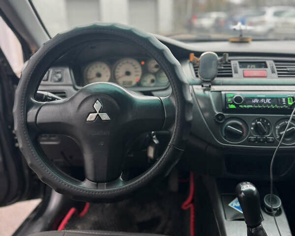 Черный Мицубиси Лансер, объемом двигателя 1.6 л и пробегом 368 тыс. км за 3200 $, фото 10 на Automoto.ua