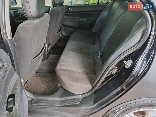 Чорний Міцубісі Lancer, об'ємом двигуна 1.58 л та пробігом 280 тис. км за 3950 $, фото 22 на Automoto.ua