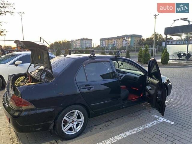 Черный Мицубиси Лансер, объемом двигателя 1.6 л и пробегом 257 тыс. км за 4500 $, фото 8 на Automoto.ua