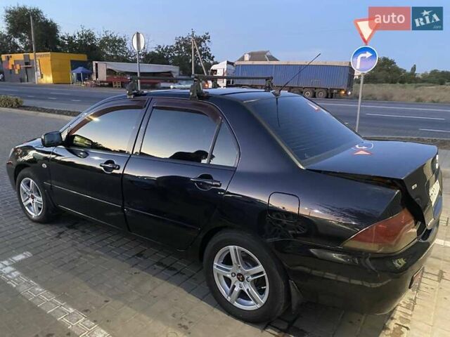 Черный Мицубиси Лансер, объемом двигателя 1.6 л и пробегом 257 тыс. км за 4500 $, фото 7 на Automoto.ua