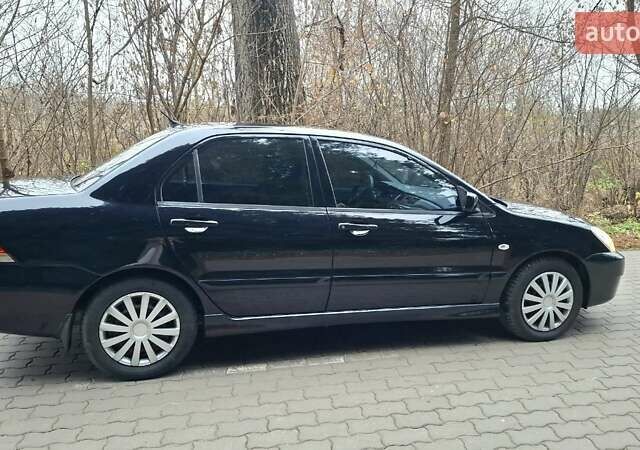 Черный Мицубиси Лансер, объемом двигателя 1.58 л и пробегом 246 тыс. км за 4200 $, фото 7 на Automoto.ua