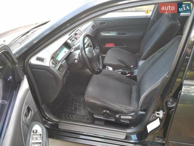 Чорний Міцубісі Lancer, об'ємом двигуна 1.58 л та пробігом 520 тис. км за 3400 $, фото 11 на Automoto.ua