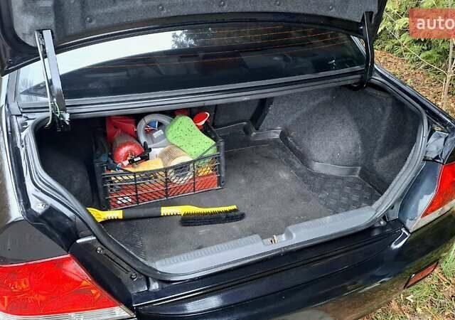 Черный Мицубиси Лансер, объемом двигателя 1.58 л и пробегом 246 тыс. км за 4200 $, фото 6 на Automoto.ua