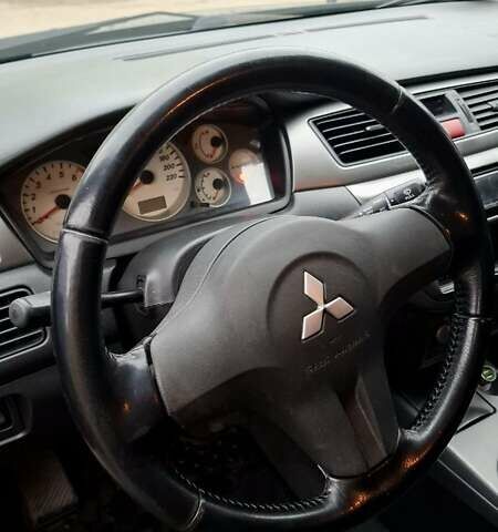 Черный Мицубиси Лансер, объемом двигателя 1.58 л и пробегом 246 тыс. км за 4200 $, фото 9 на Automoto.ua