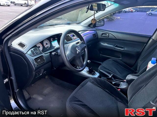 Чорний Міцубісі Lancer, об'ємом двигуна 1.6 л та пробігом 329 тис. км за 3500 $, фото 5 на Automoto.ua