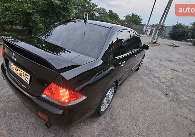 Чорний Міцубісі Lancer, об'ємом двигуна 1.6 л та пробігом 350 тис. км за 4950 $, фото 8 на Automoto.ua