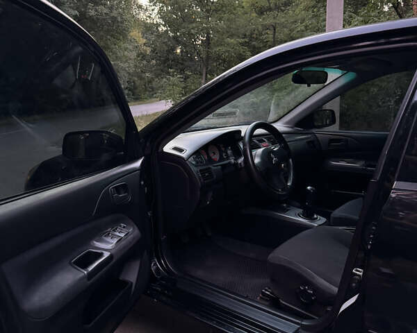 Чорний Міцубісі Lancer, об'ємом двигуна 1.6 л та пробігом 375 тис. км за 4500 $, фото 9 на Automoto.ua