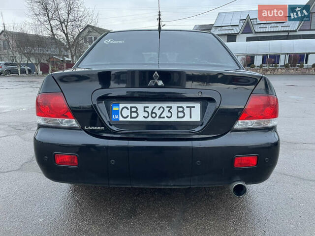 Чорний Міцубісі Lancer, об'ємом двигуна 1.58 л та пробігом 196 тис. км за 3800 $, фото 7 на Automoto.ua