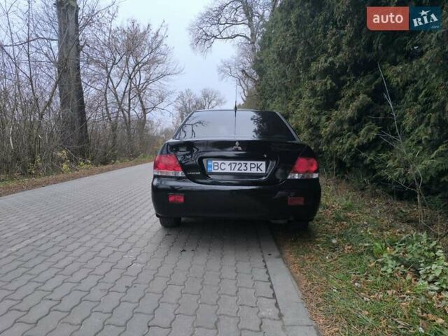 Черный Мицубиси Лансер, объемом двигателя 1.58 л и пробегом 246 тыс. км за 4200 $, фото 16 на Automoto.ua