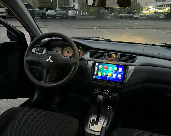 Чорний Міцубісі Lancer, об'ємом двигуна 1.58 л та пробігом 230 тис. км за 4350 $, фото 19 на Automoto.ua