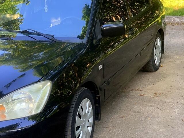 Черный Мицубиси Лансер, объемом двигателя 1.6 л и пробегом 285 тыс. км за 4400 $, фото 3 на Automoto.ua