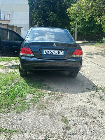 Чорний Міцубісі Lancer, об'ємом двигуна 1.58 л та пробігом 277 тис. км за 3900 $, фото 5 на Automoto.ua