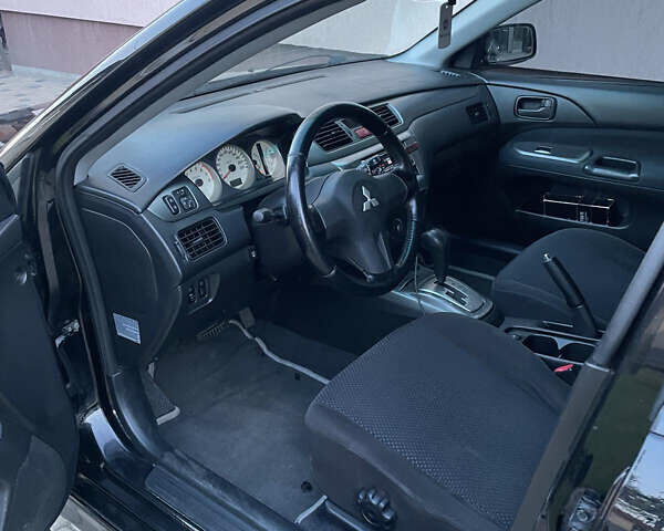 Чорний Міцубісі Lancer, об'ємом двигуна 1.6 л та пробігом 170 тис. км за 4900 $, фото 6 на Automoto.ua