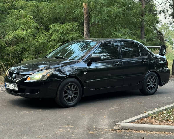 Чорний Міцубісі Lancer, об'ємом двигуна 1.6 л та пробігом 375 тис. км за 4500 $, фото 2 на Automoto.ua