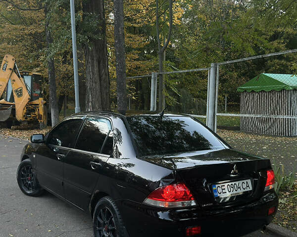 Черный Мицубиси Лансер, объемом двигателя 1.6 л и пробегом 233 тыс. км за 3650 $, фото 2 на Automoto.ua