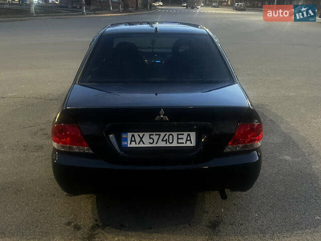 Черный Мицубиси Лансер, объемом двигателя 1.6 л и пробегом 175 тыс. км за 4000 $, фото 12 на Automoto.ua