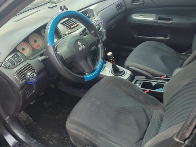 Черный Мицубиси Лансер, объемом двигателя 1.6 л и пробегом 313 тыс. км за 2450 $, фото 8 на Automoto.ua