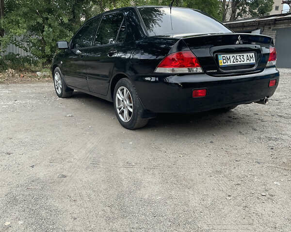 Чорний Міцубісі Lancer, об'ємом двигуна 1.6 л та пробігом 240 тис. км за 4599 $, фото 3 на Automoto.ua