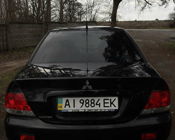 Чорний Міцубісі Lancer, об'ємом двигуна 1.58 л та пробігом 210 тис. км за 3900 $, фото 1 на Automoto.ua