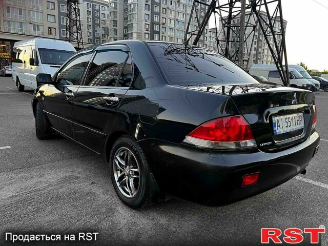 Чорний Міцубісі Lancer, об'ємом двигуна 1.6 л та пробігом 329 тис. км за 3500 $, фото 3 на Automoto.ua