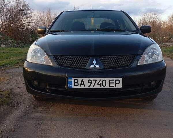 Чорний Міцубісі Lancer, об'ємом двигуна 1.6 л та пробігом 325 тис. км за 4750 $, фото 12 на Automoto.ua