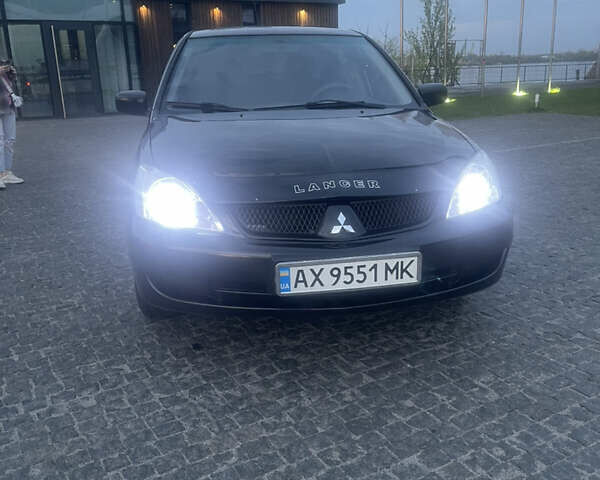 Черный Мицубиси Лансер, объемом двигателя 1.6 л и пробегом 231 тыс. км за 4250 $, фото 1 на Automoto.ua