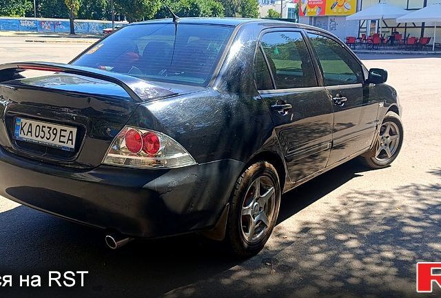 Черный Мицубиси Лансер, объемом двигателя 1.6 л и пробегом 238 тыс. км за 4300 $, фото 1 на Automoto.ua