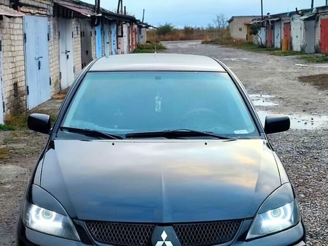 Чорний Міцубісі Lancer, об'ємом двигуна 1.6 л та пробігом 240 тис. км за 4000 $, фото 6 на Automoto.ua
