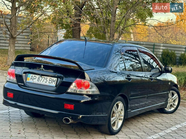 Міцубісі Lancer 2006 у Дніпро (Дніпропетровську) на Automoto.ua Чорний Міцубісі Lancer, об'ємом двигуна 2 л та пробігом 230 тис. км за 4900 $, фото 11 на Automoto.ua