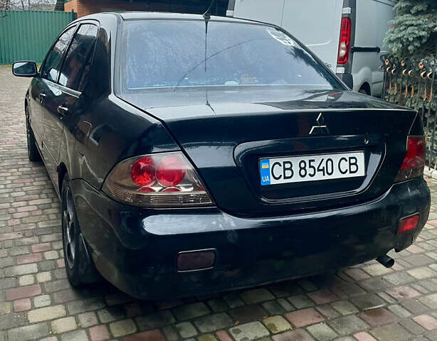 Чорний Міцубісі Lancer, об'ємом двигуна 1.59 л та пробігом 305 тис. км за 2950 $, фото 16 на Automoto.ua