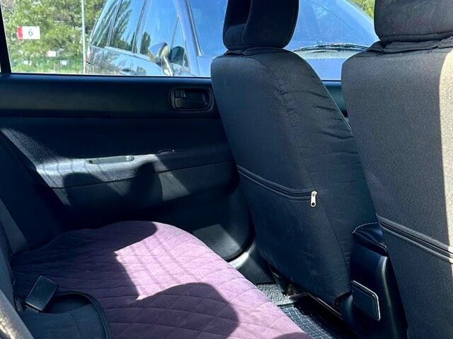 Черный Мицубиси Лансер, объемом двигателя 1.6 л и пробегом 230 тыс. км за 3200 $, фото 5 на Automoto.ua