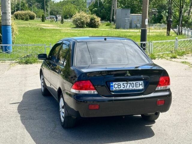 Чорний Міцубісі Lancer, об'ємом двигуна 0.16 л та пробігом 196 тис. км за 4400 $, фото 7 на Automoto.ua