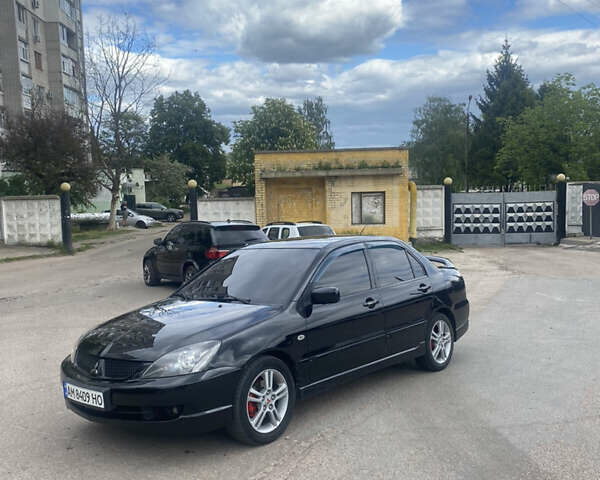 Чорний Міцубісі Lancer, об'ємом двигуна 2 л та пробігом 183 тис. км за 4500 $, фото 28 на Automoto.ua