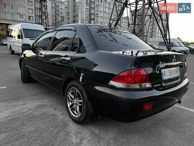 Чорний Міцубісі Lancer, об'ємом двигуна 1.58 л та пробігом 329 тис. км за 3500 $, фото 4 на Automoto.ua
