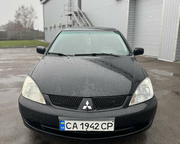 Черный Мицубиси Лансер, объемом двигателя 1.6 л и пробегом 368 тыс. км за 3200 $, фото 1 на Automoto.ua