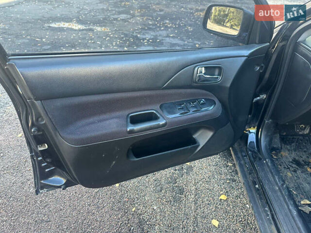 Чорний Міцубісі Lancer, об'ємом двигуна 2 л та пробігом 270 тис. км за 3300 $, фото 6 на Automoto.ua
