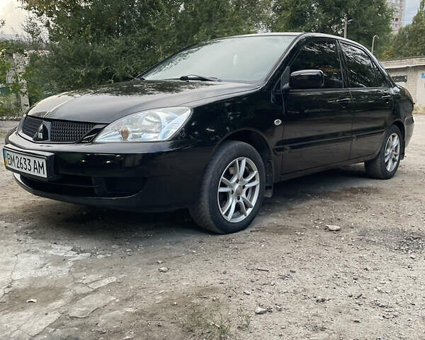 Чорний Міцубісі Lancer, об'ємом двигуна 1.6 л та пробігом 240 тис. км за 4599 $, фото 2 на Automoto.ua