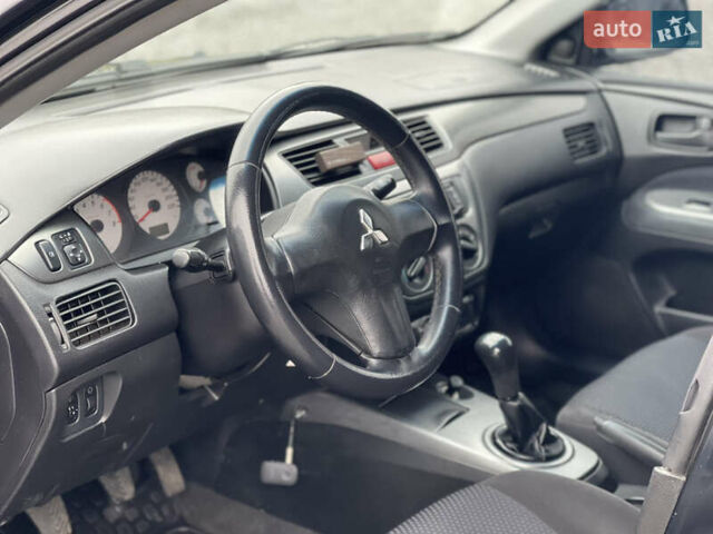 Чорний Міцубісі Lancer, об'ємом двигуна 1.58 л та пробігом 230 тис. км за 3350 $, фото 15 на Automoto.ua