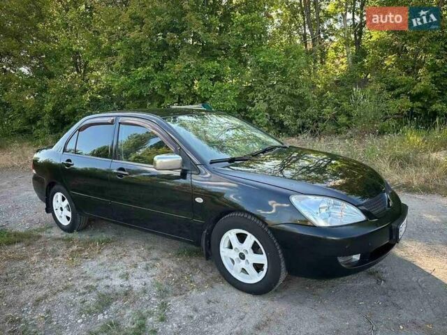 Мицубиси Лансер 2006 в Киеве на Automoto.ua Черный Мицубиси Лансер, объемом двигателя 1.58 л и пробегом 268 тыс. км за 3400 $, фото 9 на Automoto.ua