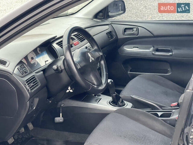 Чорний Міцубісі Lancer, об'ємом двигуна 1.58 л та пробігом 230 тис. км за 3350 $, фото 16 на Automoto.ua