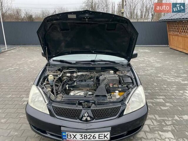 Чорний Міцубісі Lancer, об'ємом двигуна 1.58 л та пробігом 282 тис. км за 4100 $, фото 4 на Automoto.ua