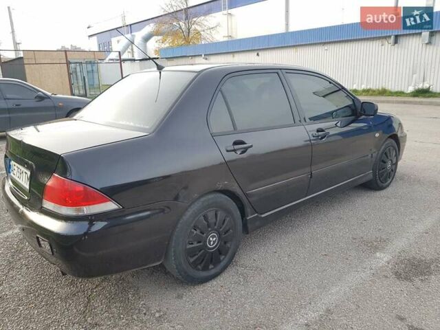Чорний Міцубісі Lancer, об'ємом двигуна 1.58 л та пробігом 290 тис. км за 3200 $, фото 10 на Automoto.ua